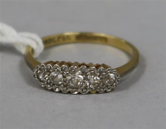 An Edwardian 18ct gold and platinum five stone diamond ring.